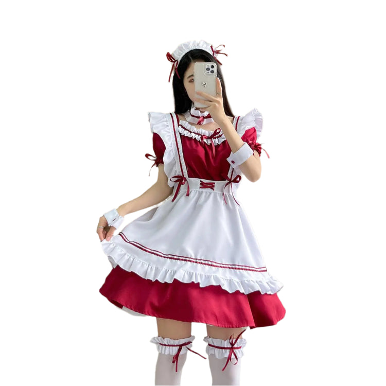 Person wearing a red and white maid outfit taking a mirror selfie.