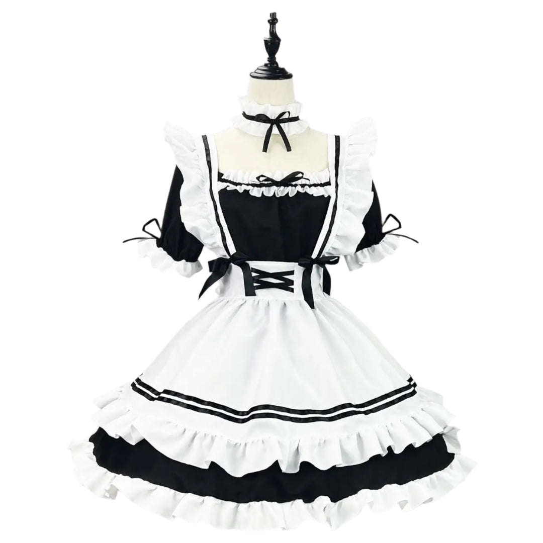 Black and white maid costume on a mannequin against a gray background