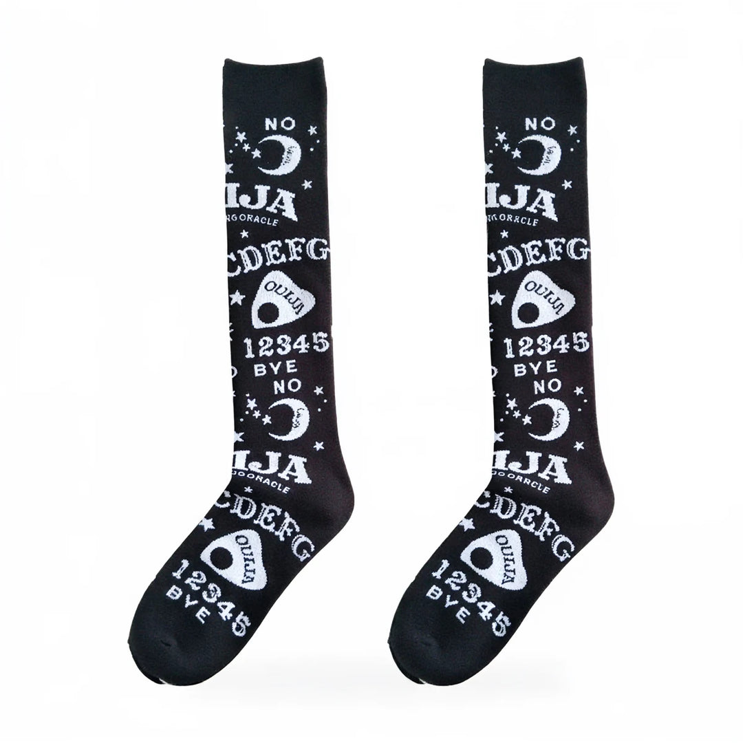 Dark magic stockings in black, featuring white Ouija board symbols and text.