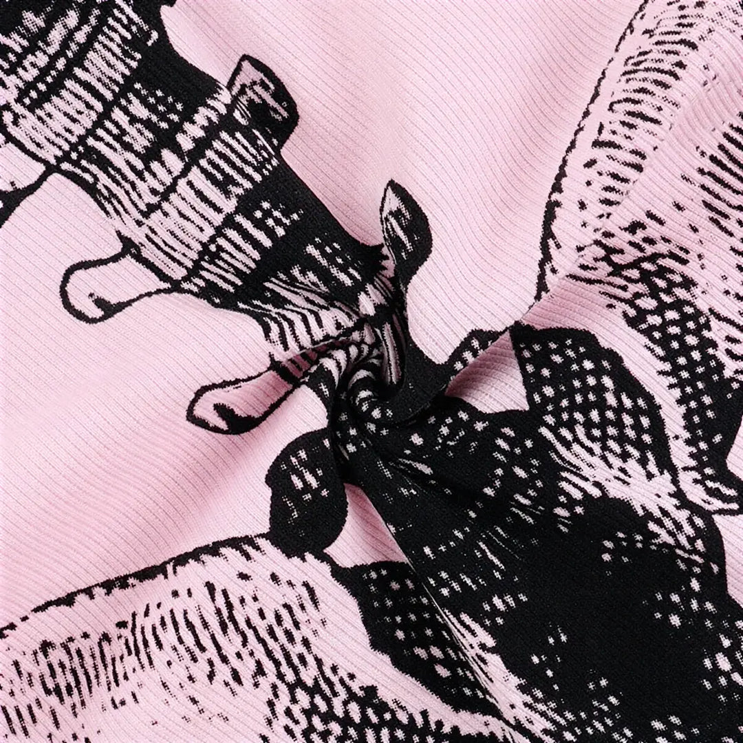 Barely Living Playsuit in pink with black floral print and ribbed texture.