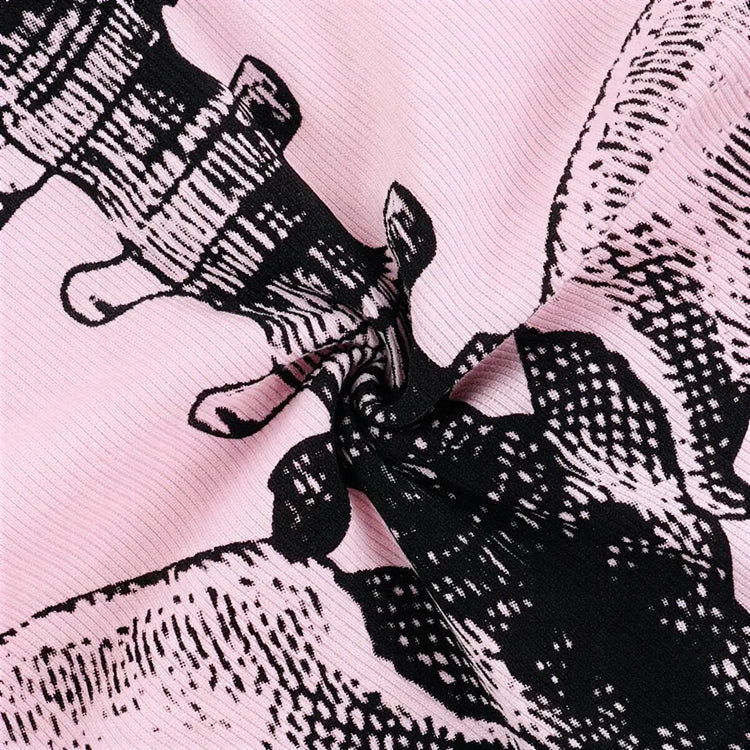 Barely Living Playsuit in pink with black floral print and ribbed texture.