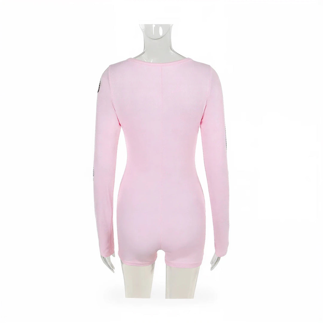 Pink long-sleeved playsuit with subtle seam detailing and sleeve accents.