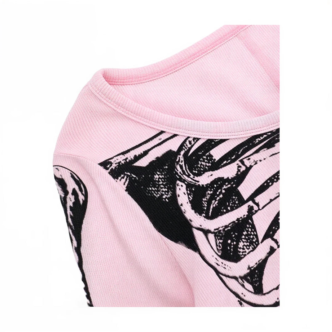 Pink playsuit with black graphic print, ribbed fabric, round neckline.