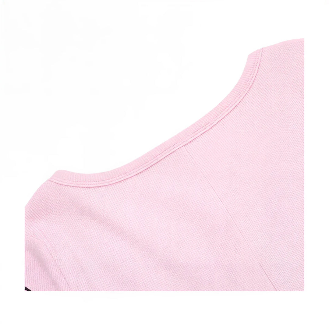 Pink ribbed playsuit with round neckline and fitted sleeveless design.