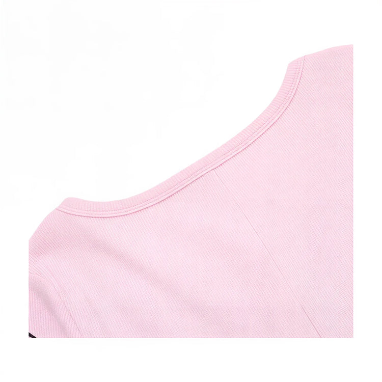 Pink ribbed playsuit with round neckline and fitted sleeveless design.