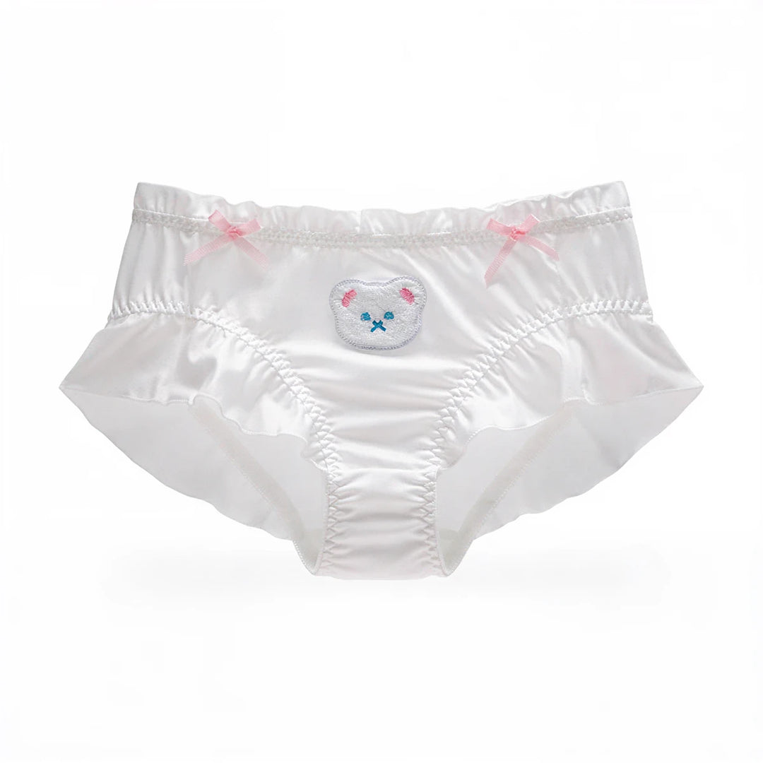 White satin panties with ruffled edges, pink bows, and embroidered bear face.