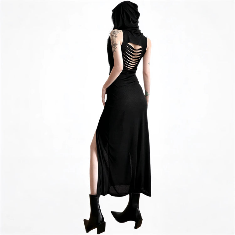 Black sleeveless dress with back cutouts and side slit, made of flowing fabric.