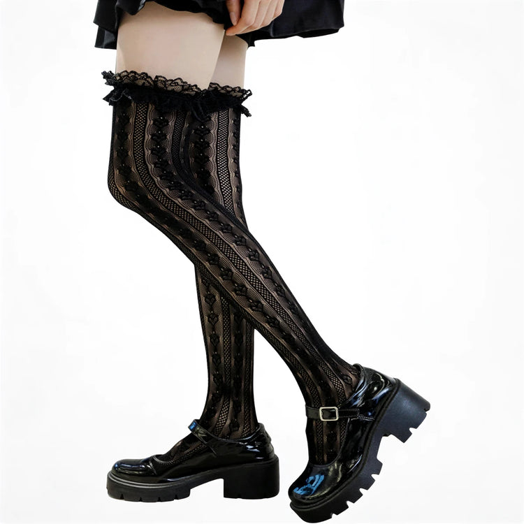 Black lace thigh-high stockings with ruffled top edge and patterned design.