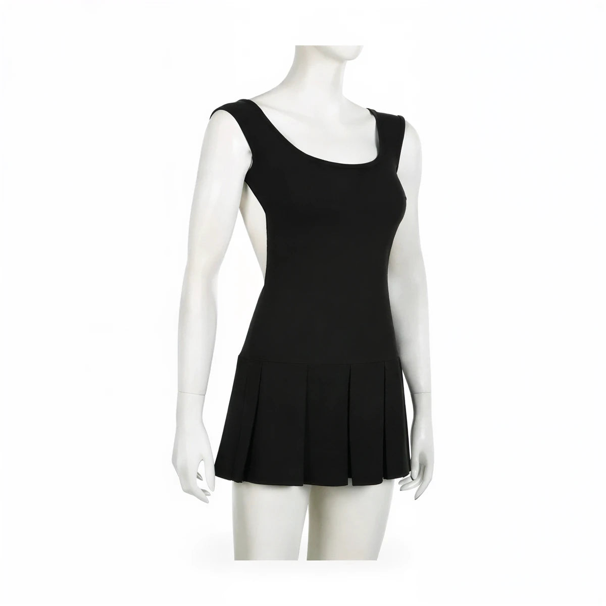 Backless mini dress in black, stretch knit, pleated skirt hem.