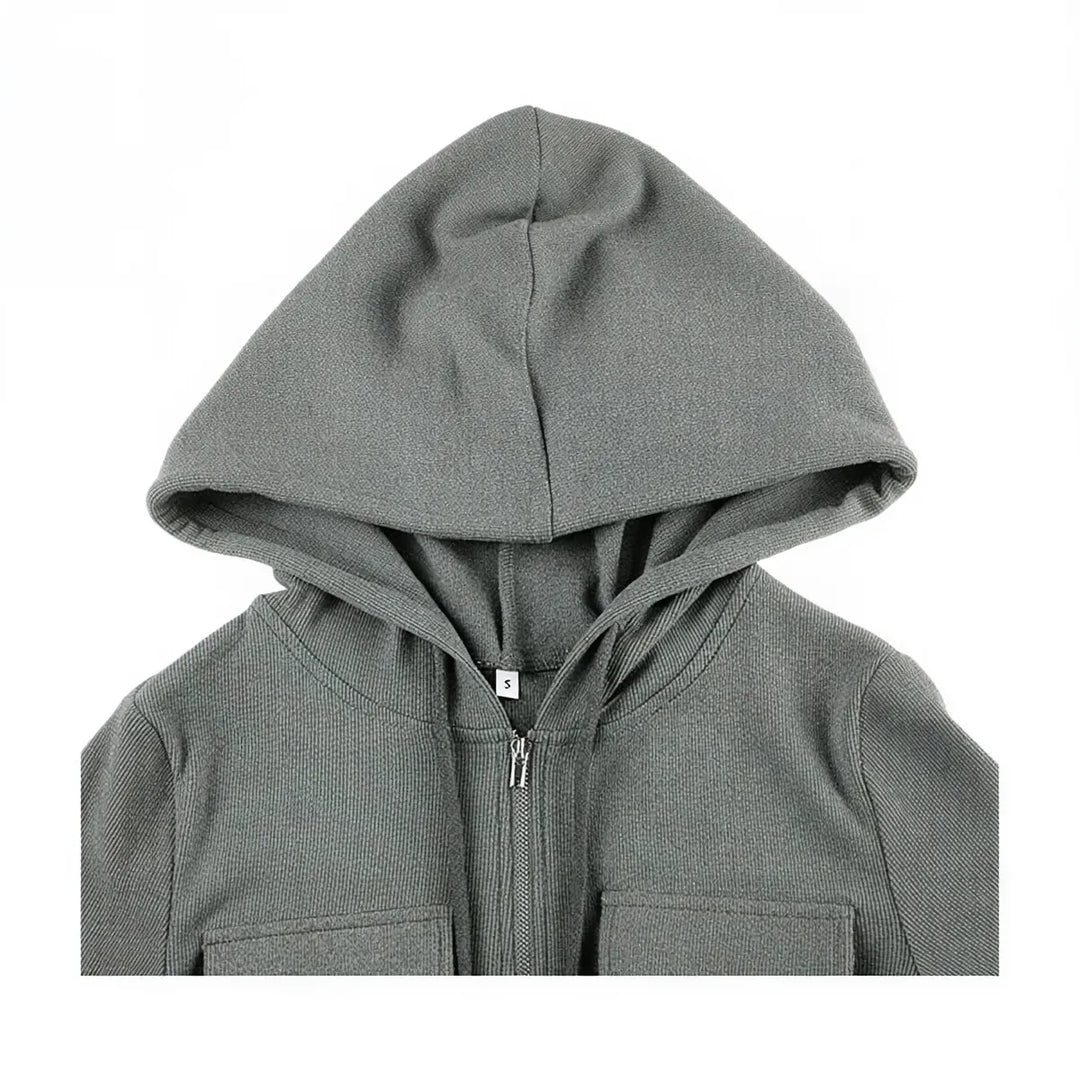 Grey zip-up dress with hood and front pockets, ribbed knit fabric.