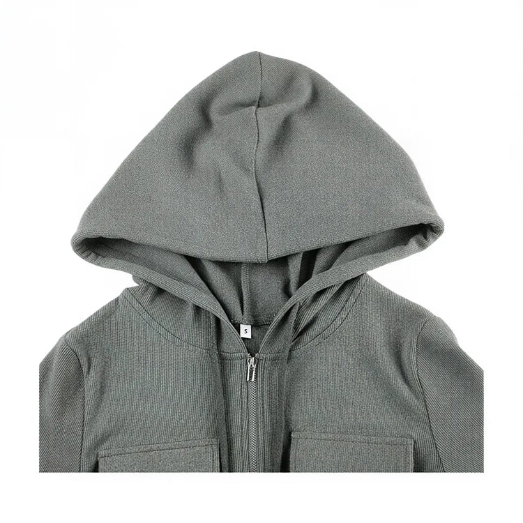 Grey zip-up dress with hood and front pockets, ribbed knit fabric.