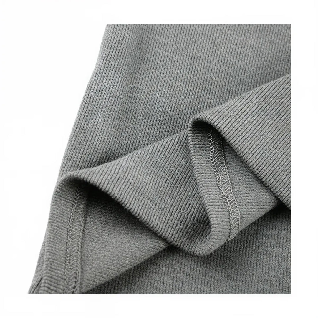 Grey ribbed knit zip-up dress with subtle seam detailing.