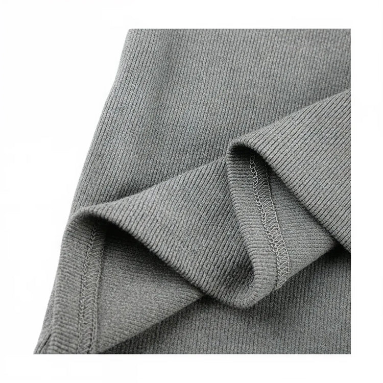 Grey ribbed knit zip-up dress with subtle seam detailing.
