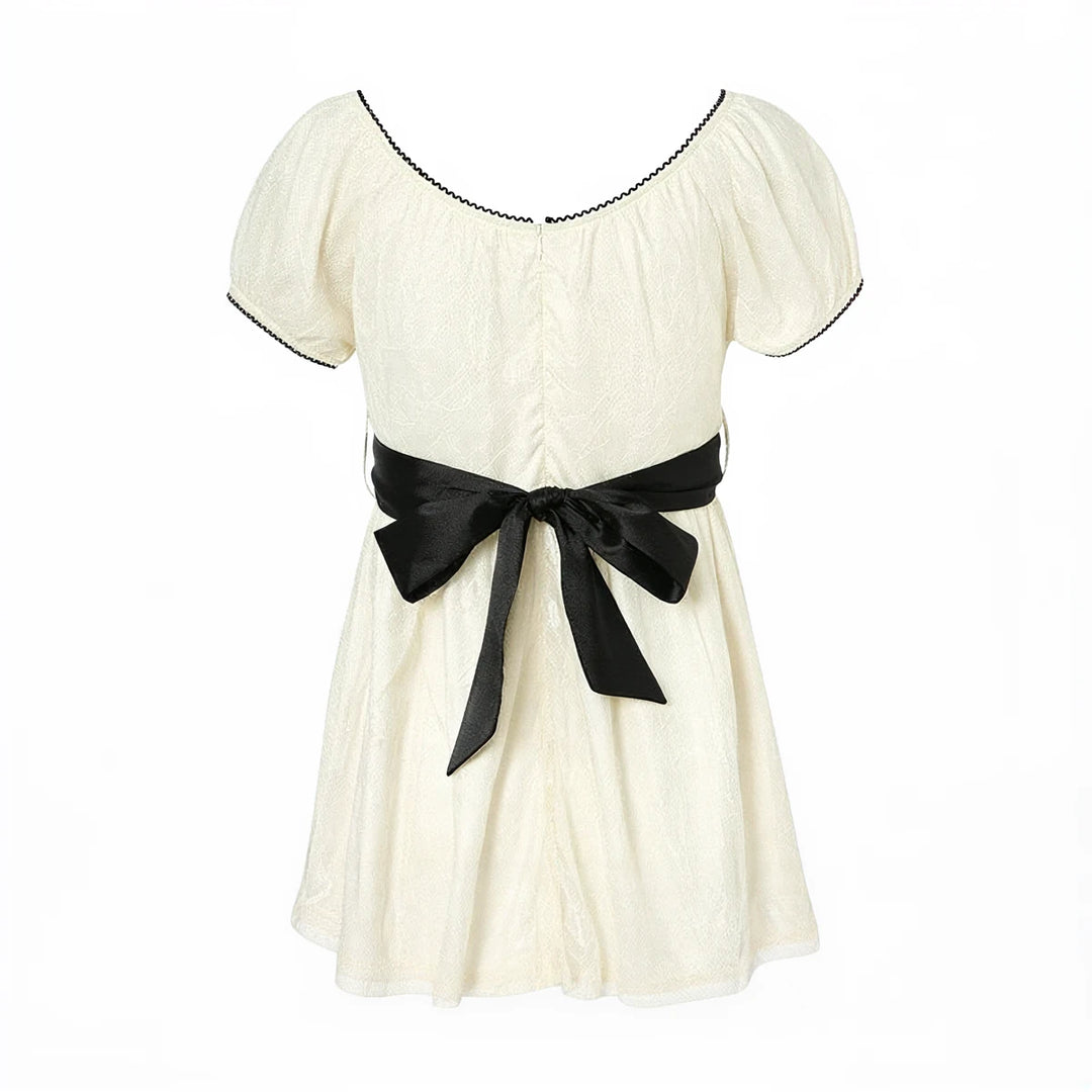 Fairy Hunter Lace Dress in cream, featuring black trim and satin bow waist.