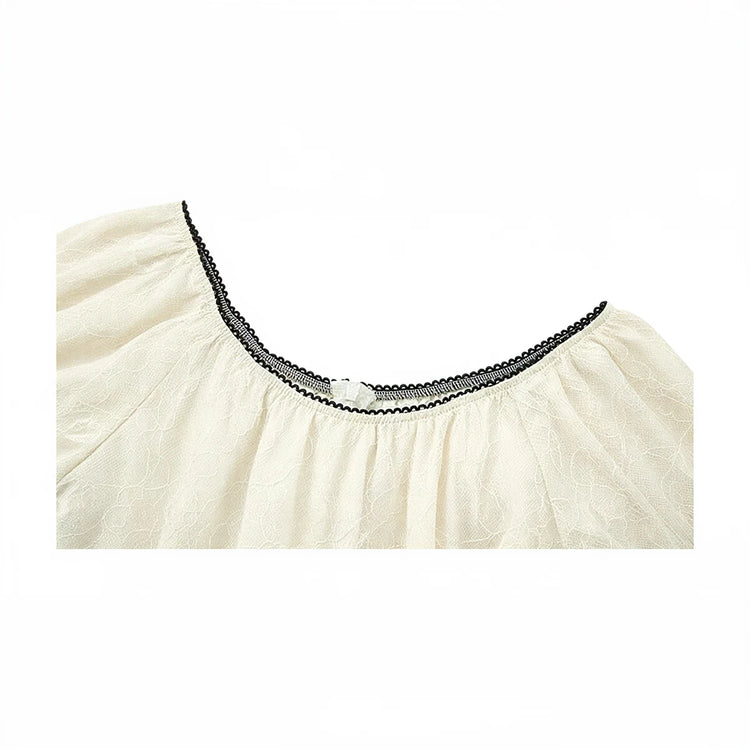 Fairy Hunter Lace Dress, cream-colored lace with black trim neckline.