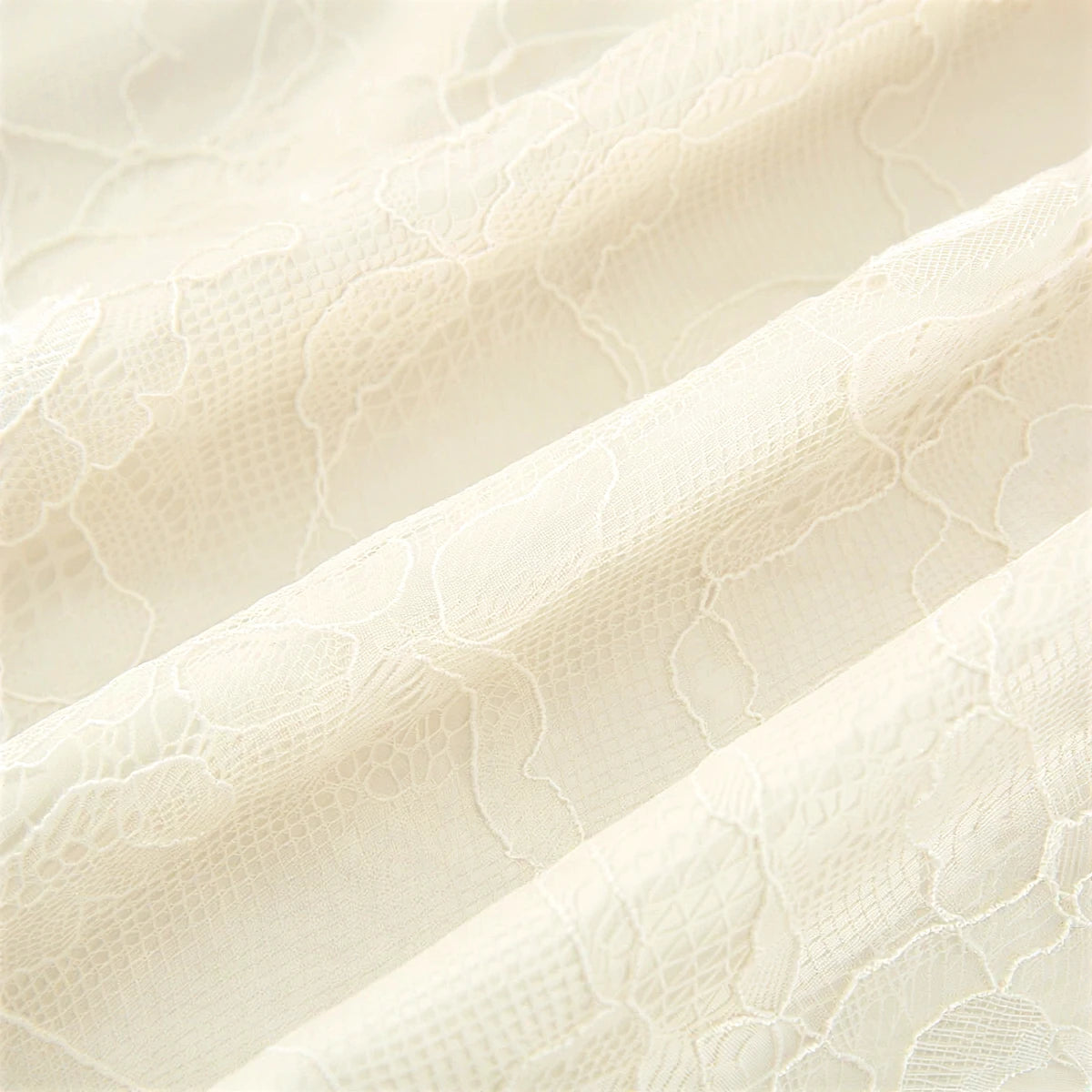 Fairy Hunter lace dress, cream, delicate floral patterned fabric.