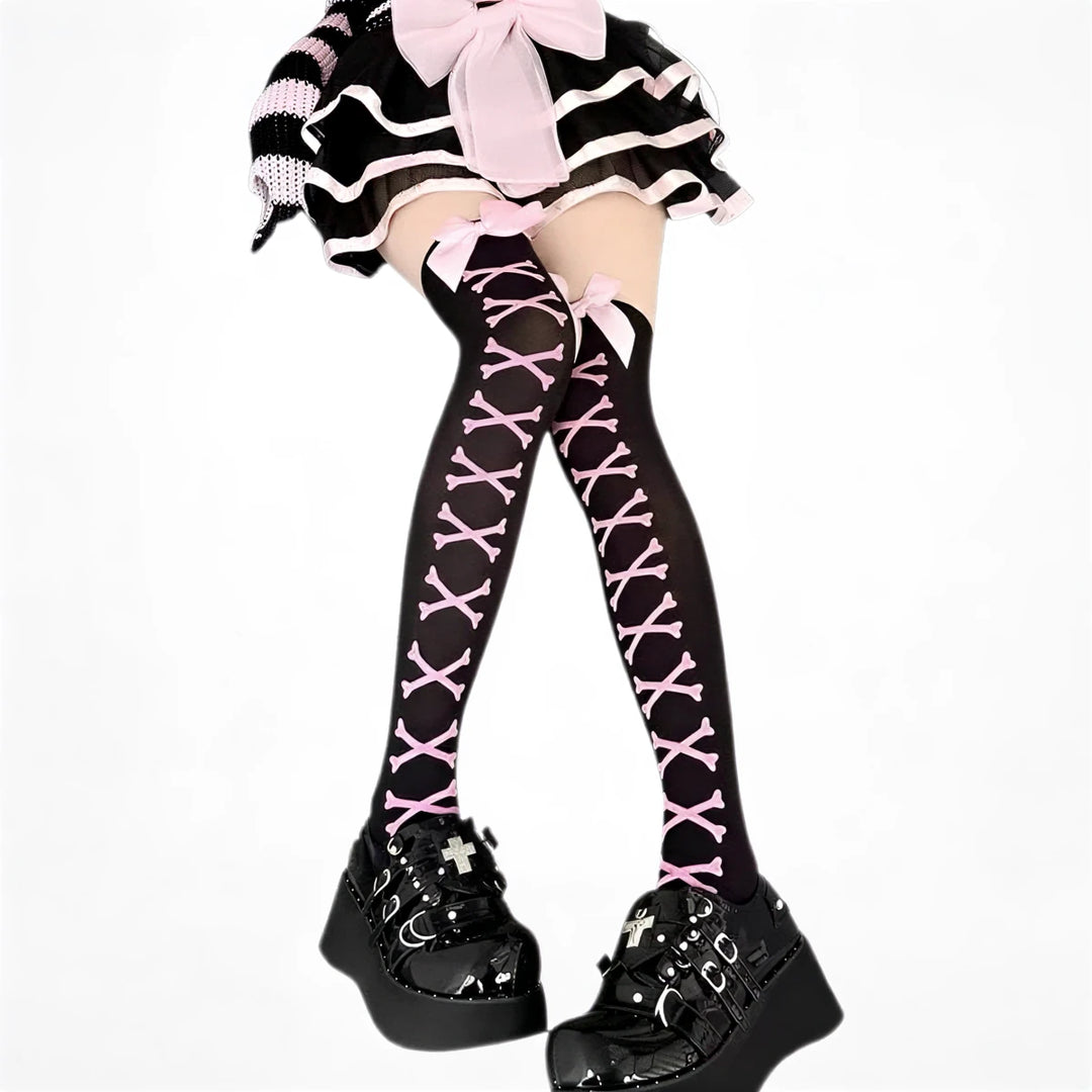 Pink bones patterned thigh-high stockings, black base, sheer fabric with lace-up design.