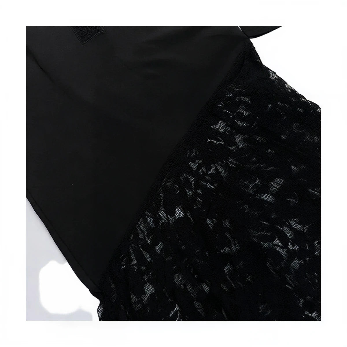 Black lace dress with satin bodice and floral patterned detailing.