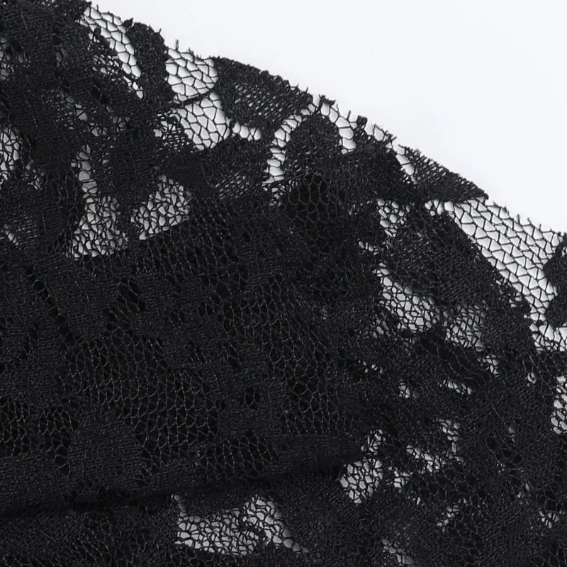 Black lace dress with intricate floral pattern and sheer texture.