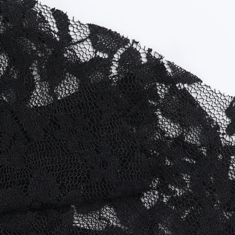 Black lace dress with intricate floral pattern and sheer texture.