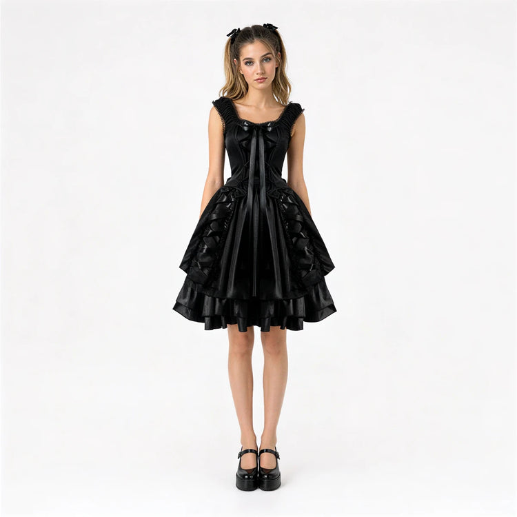 Black ruffled dress with satin bow and tiered skirt.