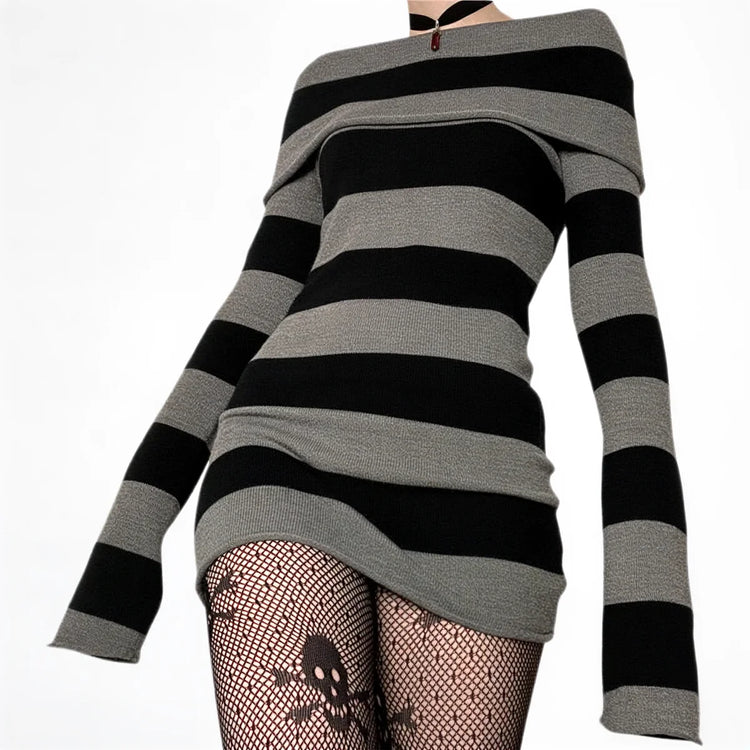Striped off-shoulder knit dress in black and gray with skull-patterned tights.