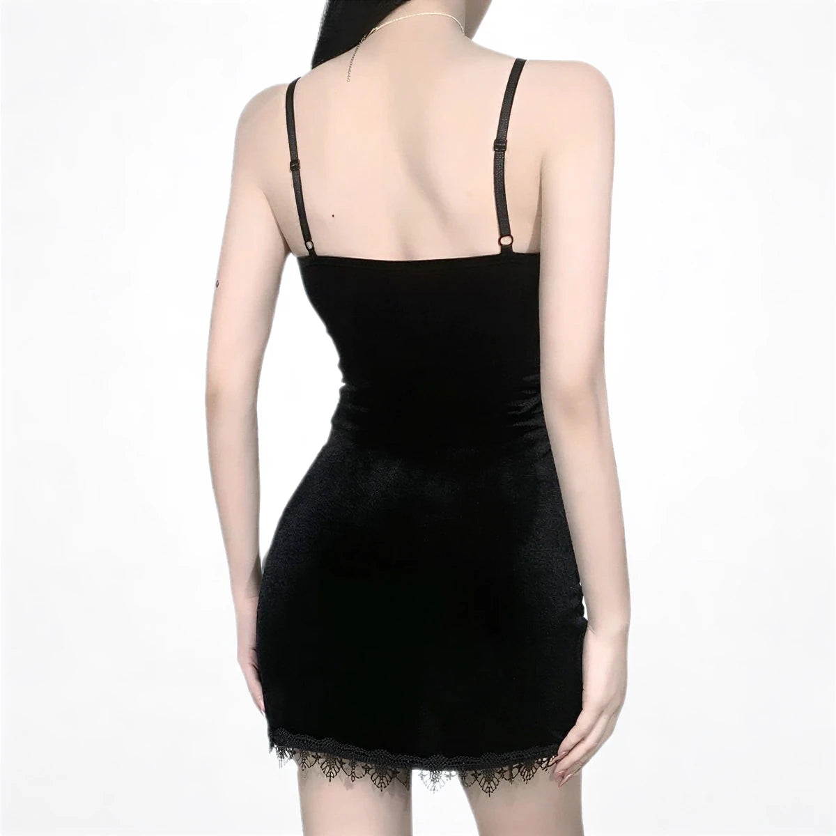 Black velvet mini dress with lace hem and thin straps.