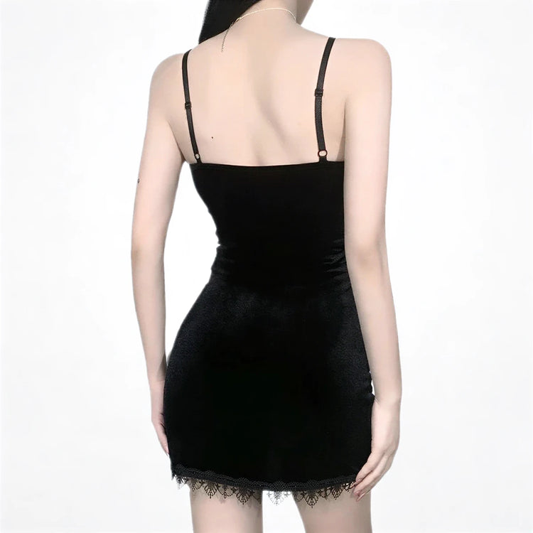 Black velvet mini dress with lace hem and thin straps.