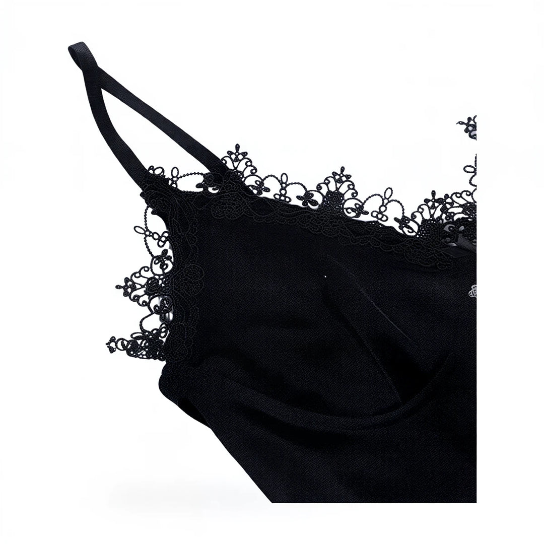 Black velvet dress with lace trim and thin straps.