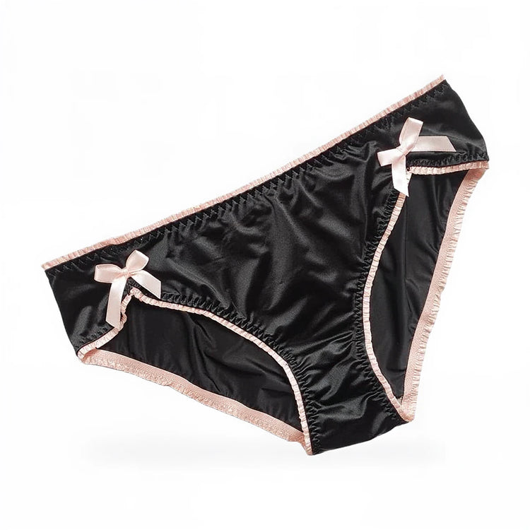 Black satin panties with pink trim and bow accents.