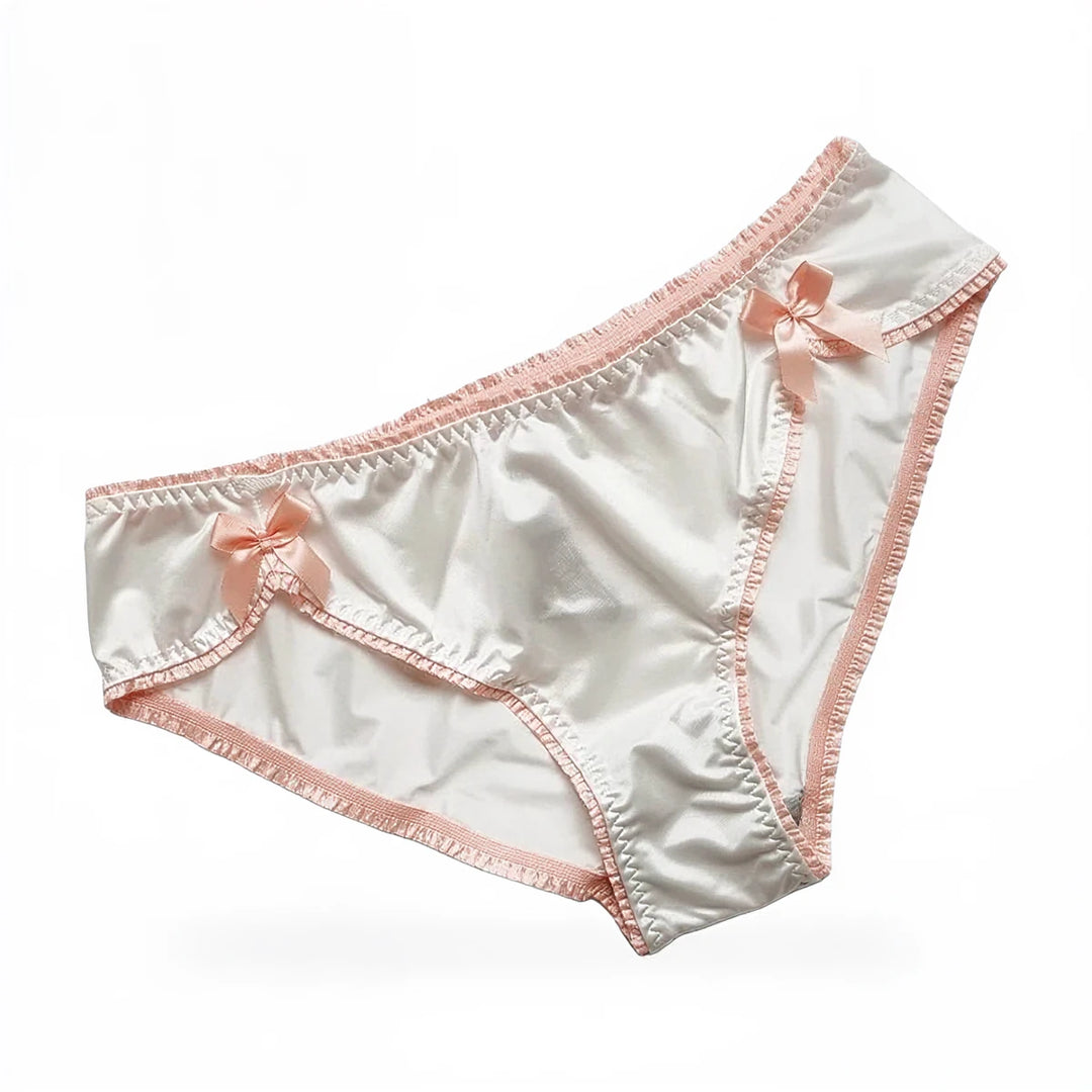 Vintage satin panties, cream with pink trim and bow accents.