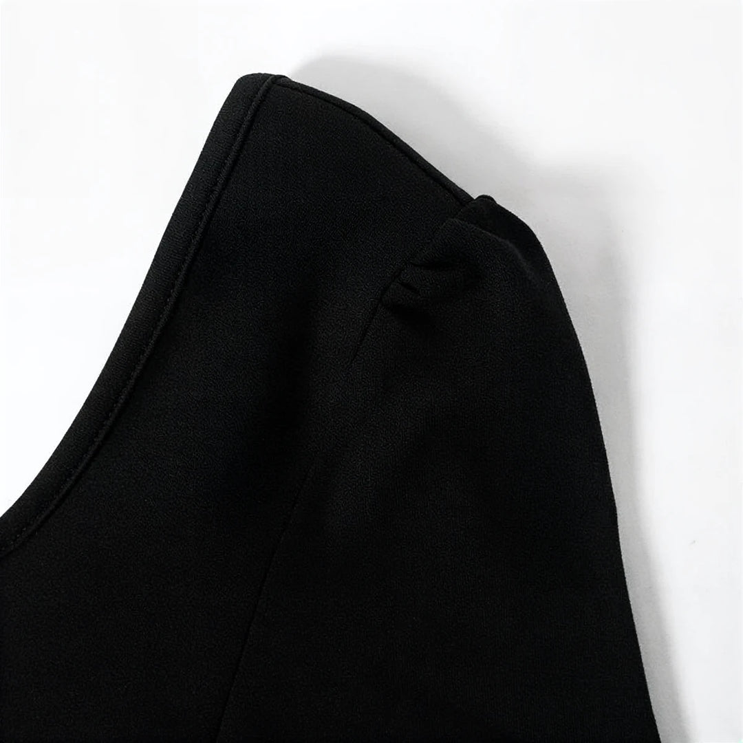 Midnight Mermaid Gown: black satin fabric with elegant shoulder ruching detail.