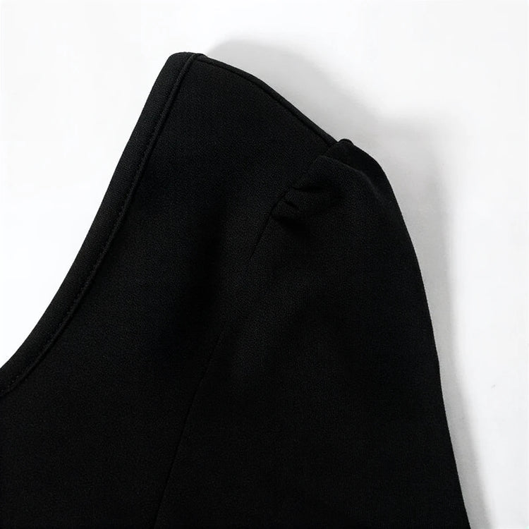 Midnight Mermaid Gown: black satin fabric with elegant shoulder ruching detail.