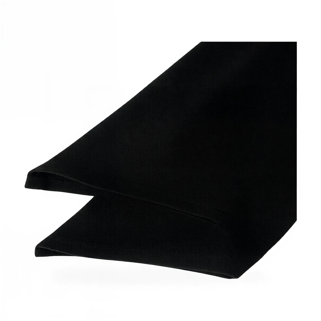 Black velvet gown with sleek silhouette and smooth texture.