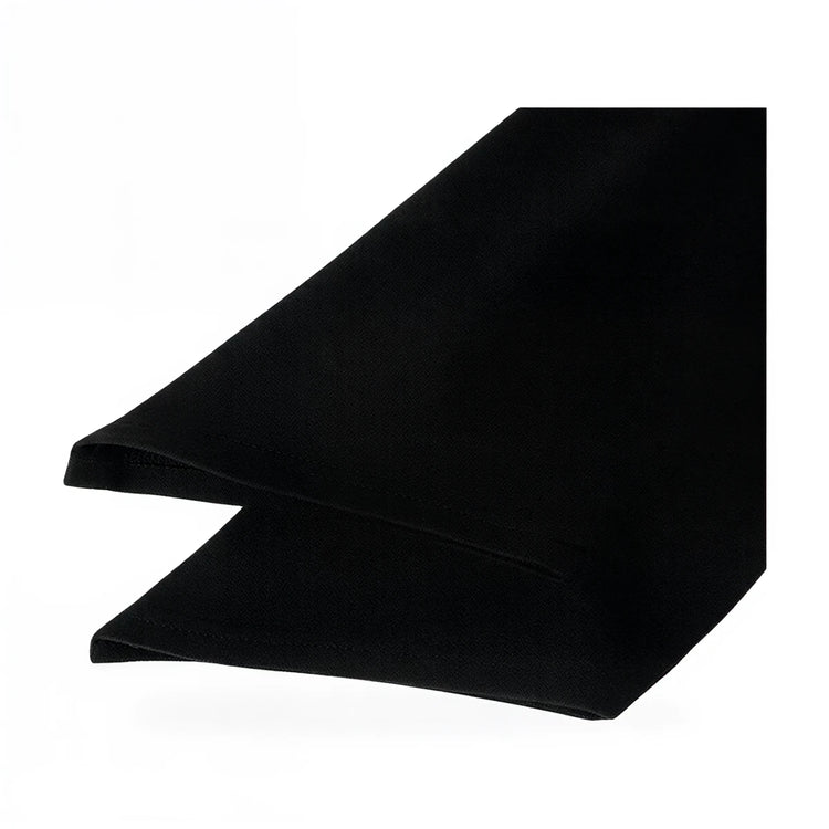 Black velvet gown with sleek silhouette and smooth texture.