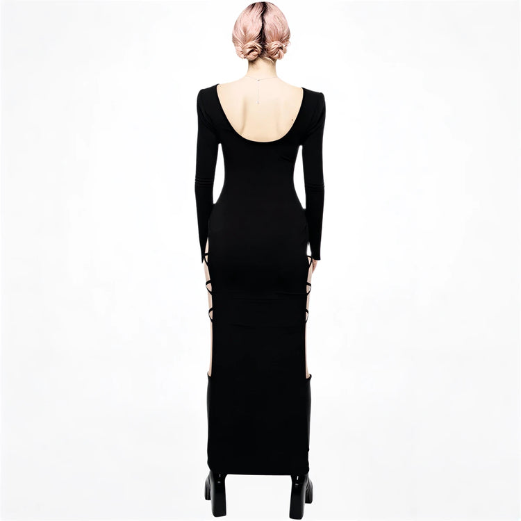 Black long-sleeve mermaid gown with back cutout and side slits.