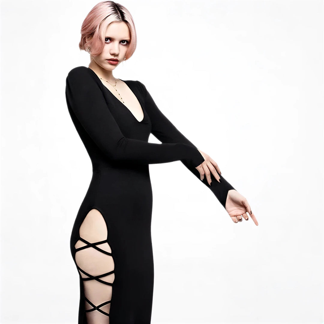 Black long-sleeve mermaid gown with side cutouts and criss-cross straps.