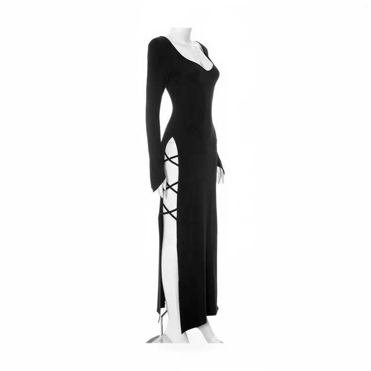 Black long-sleeve mermaid gown with side slit and lace-up detail.