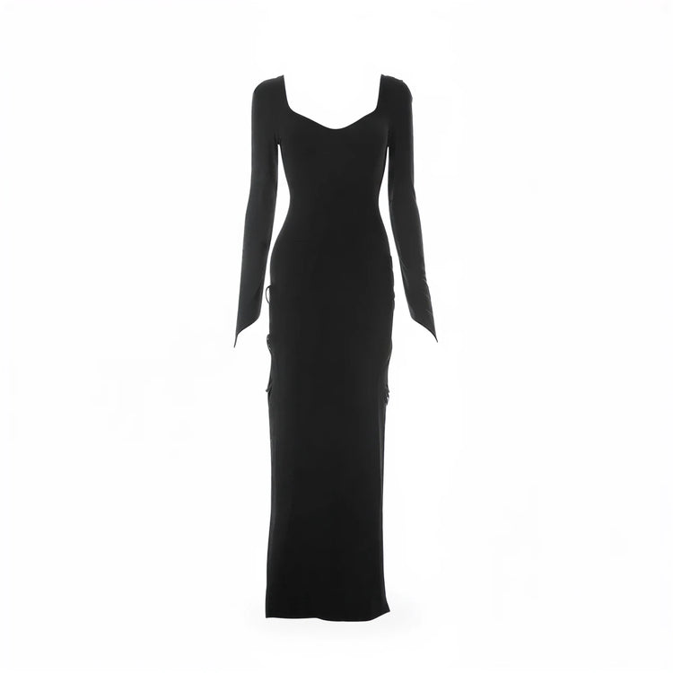 Black mermaid gown with long sleeves and side slit detailing.
