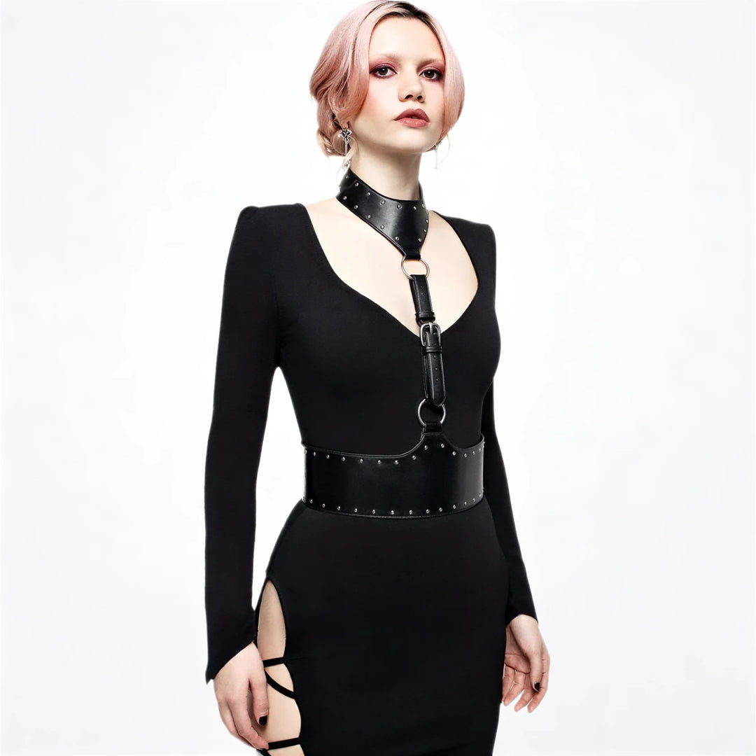 Black leather-look gown with studded harness and thigh cutouts.