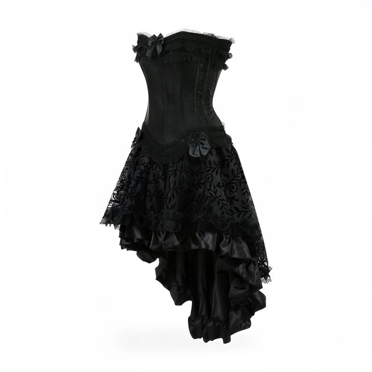 Black corset dress with lace, ruffles, and bows, asymmetrical hem.