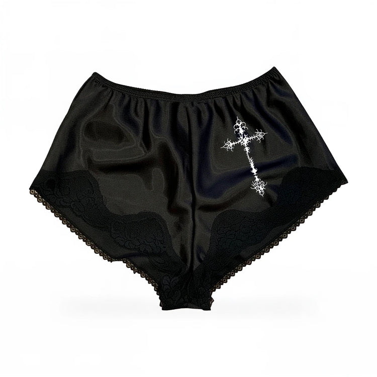 Salem satin shorts in black, featuring lace trim and a white cross embellishment.