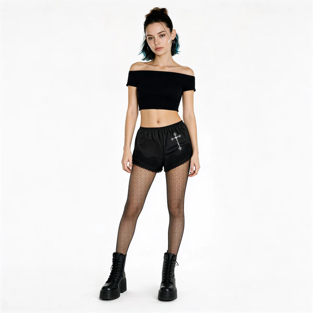 Black satin shorts with cross embroidery and frayed hem.