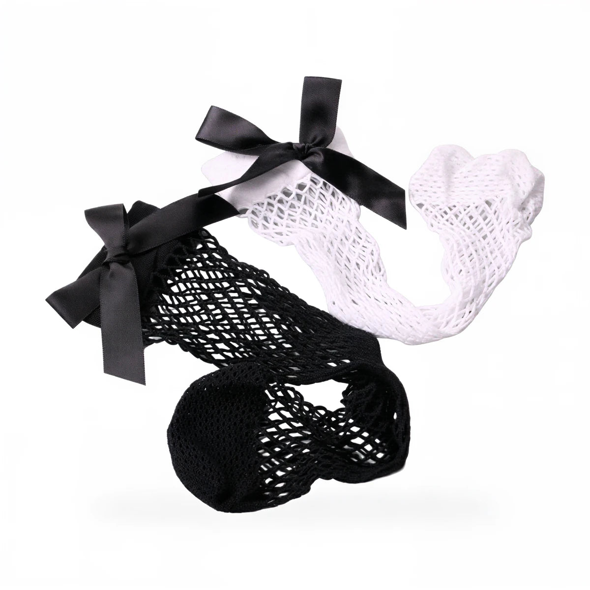 Fishnet socks in black and white, each with a satin bow at top.