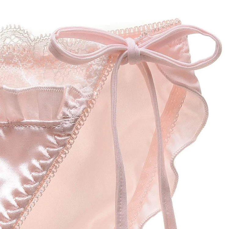 Pink satin panties with lace trim and bow tie detail.