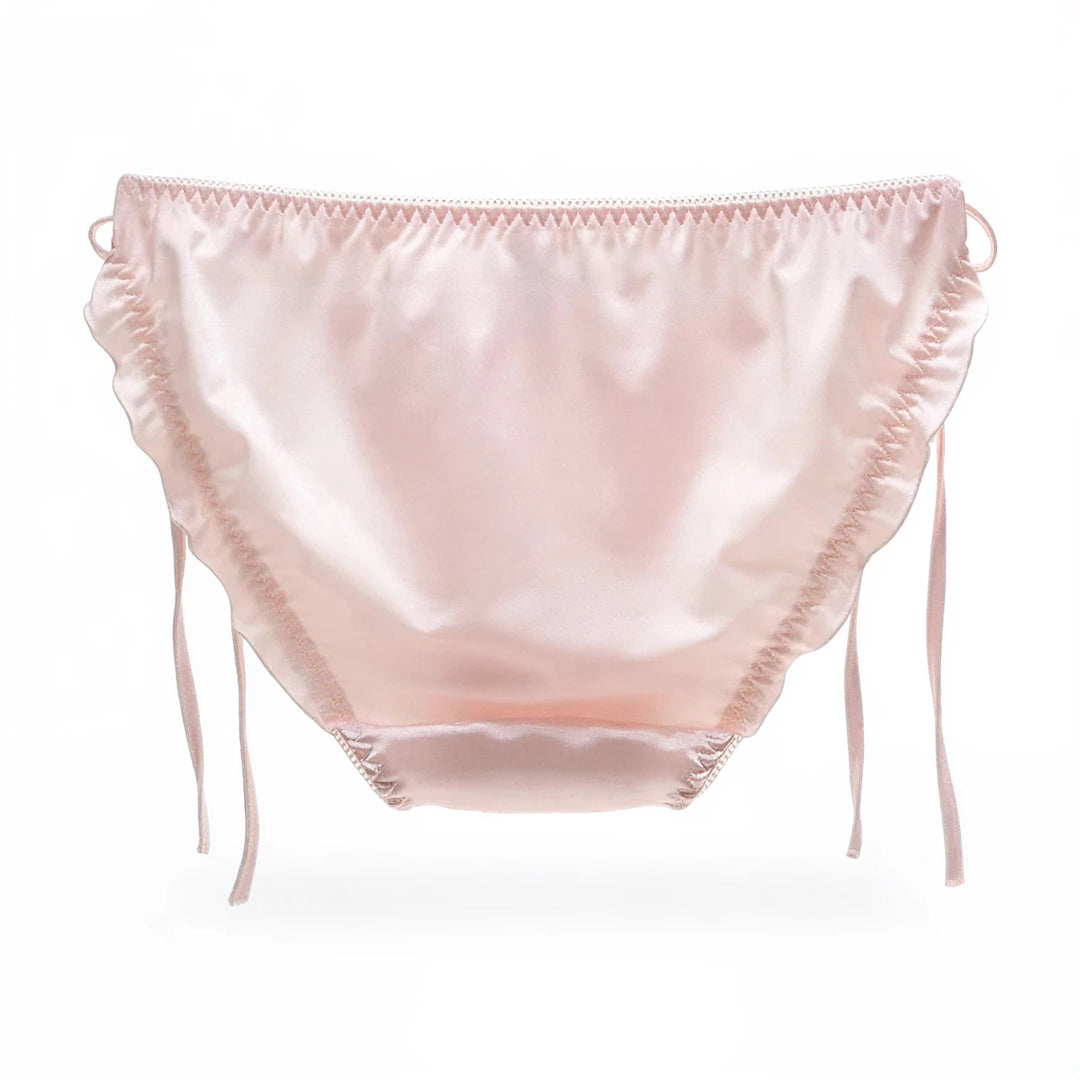 Pink satin panties with ruffled edges and side ties.