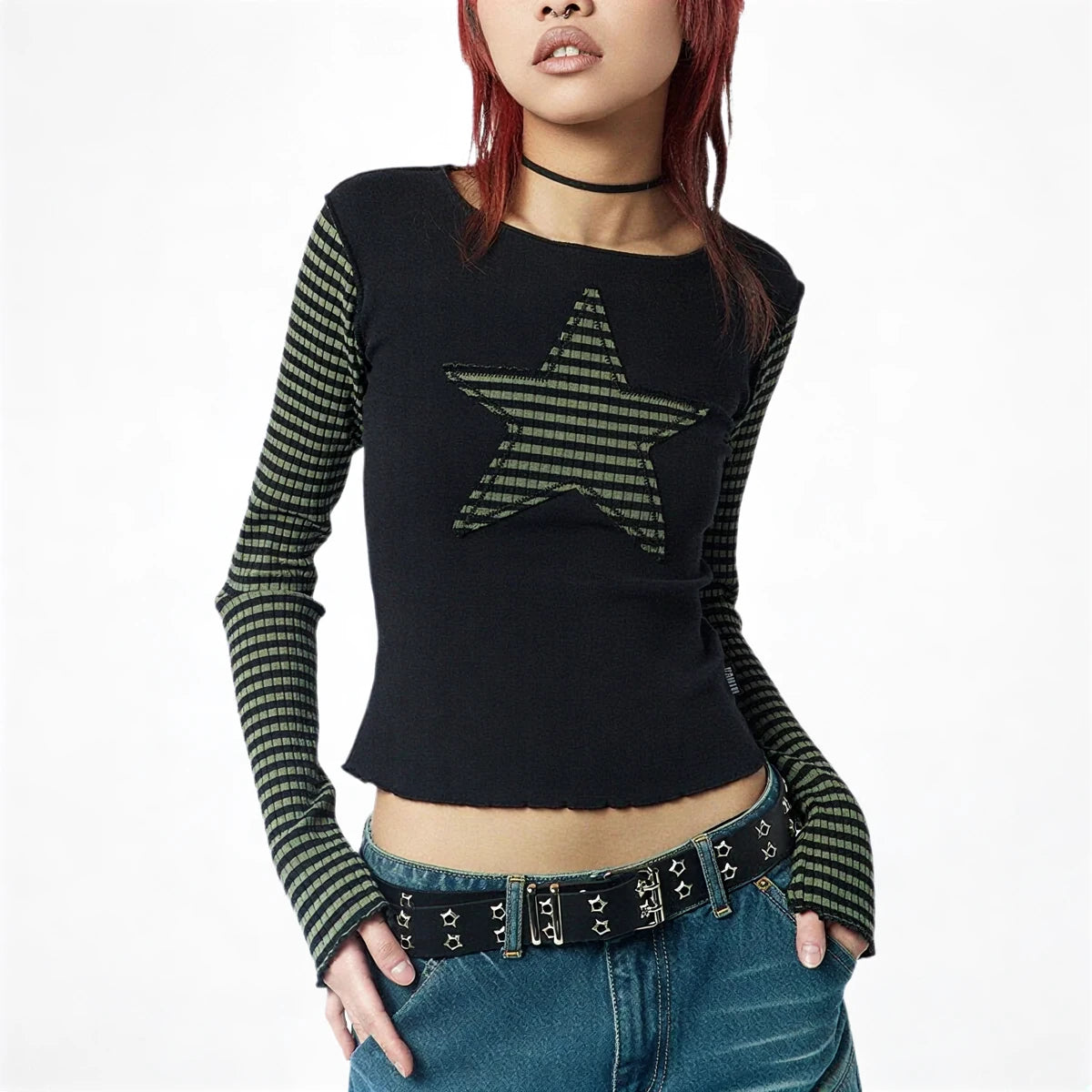 Black long sleeve crop top with striped star design and ribbed texture.