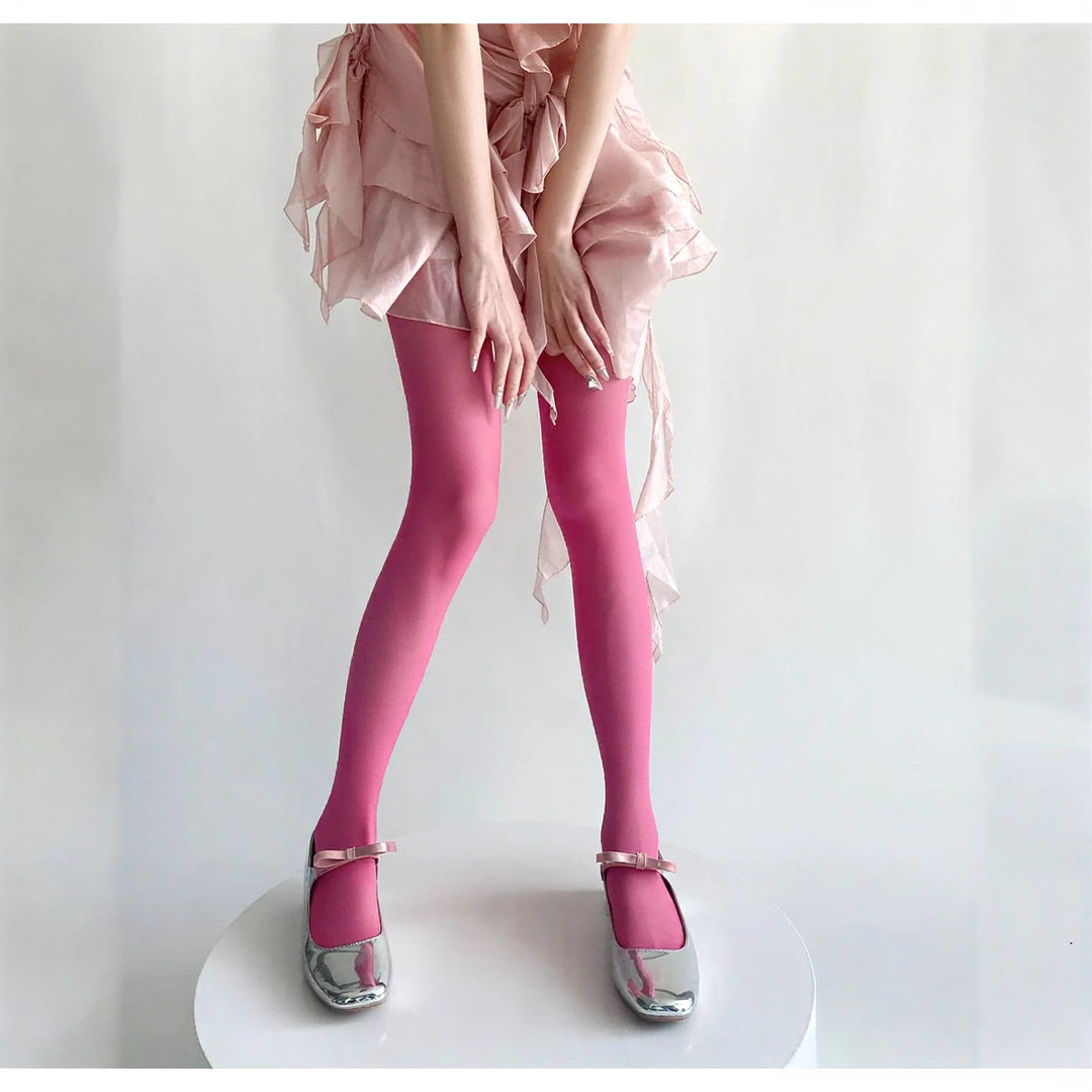 Vibe Legwear: vibrant pink sheer tights with smooth finish and subtle sheen.