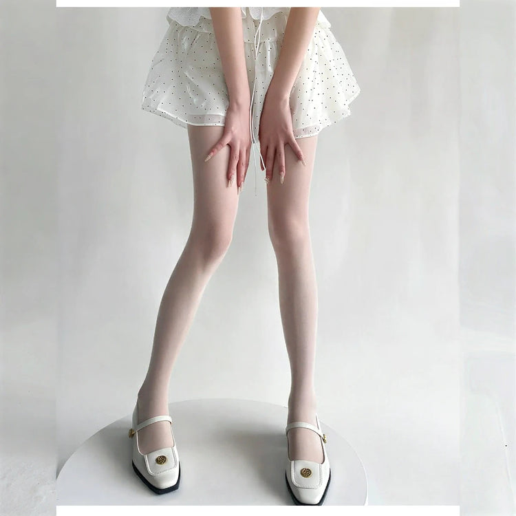 Vibe Legwear: sheer white stockings with subtle dot pattern and smooth texture.