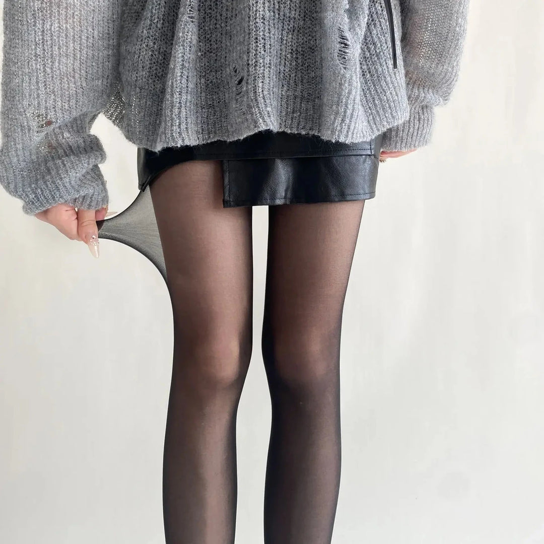 Vibe Legwear: sheer black tights with smooth texture and seamless finish.